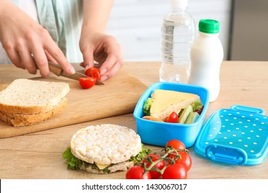 Woman Preparing Tasty Lunch In Kitchen