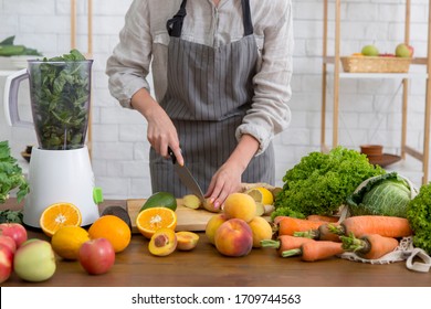 Woman Preparing Vegetarian Smoothie Drink, Diet And Body Cleansing To Remove Toxins, Kitchen Background