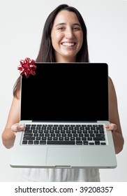 A Woman Presenting A New Laptop Computer As A Gift