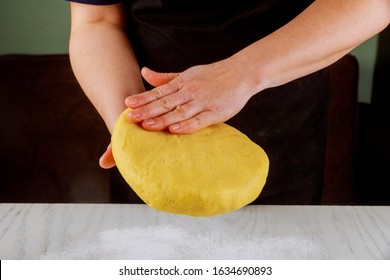 A Woman Presses On Flaky Dough For Making Sugar Cookies.