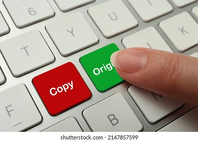 Woman pressing green button with word Original on computer keyboard, closeup. Plagiarism concept - Shutterstock ID 2147857599