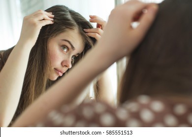Woman with problematic hair - Shutterstock ID 585551513
