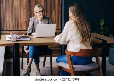 Woman professional HR interviews a candidate for a vacancy