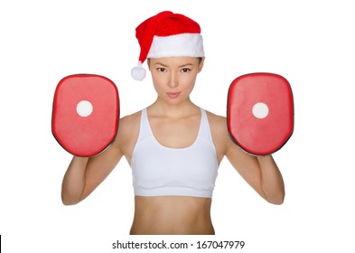 Woman protects herself in Santa Claus hat isolated on white - Powered by Shutterstock