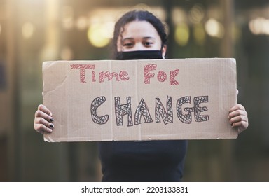 Woman, Protest And Sign For Change In Human Rights, Gender Based Violence Or Equality Against A Bokeh Background. Female Activist Protesting Holding Billboard Message To Voice Community Improvement