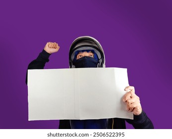 A woman protester with helmet and mask, holding a blank poster. - Powered by Shutterstock