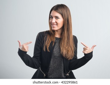 Woman Proud Of Herself Over Grey Background
