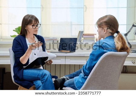 Similar – Female doctor talking to elderly patient in wheelchair