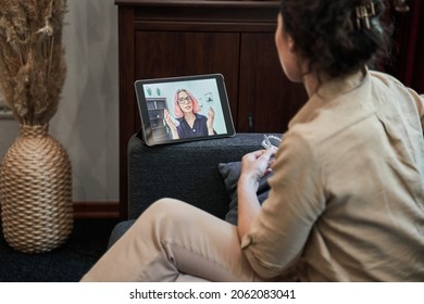 Woman psychologist sitting at casual home office and helping online to her patient