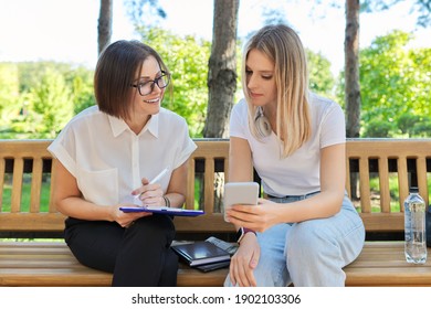 Woman Psychologist, Social Worker, Teacher Talking With University Student Sitting On Bench In College Park, Interviewing Consultation Interview