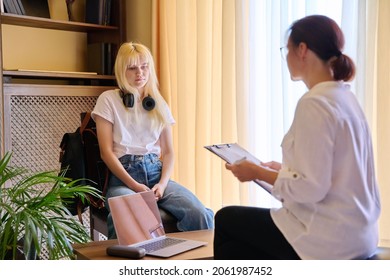 Woman Psychologist Working With Teen Girl In Office.