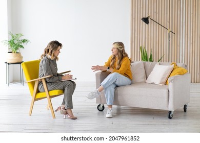 Woman psychologist works with teenage girl in her office. Psychological health.