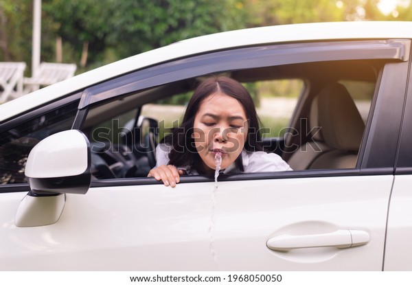 Woman puke or vomiting on window in car,Car Sick\
and motion sickness