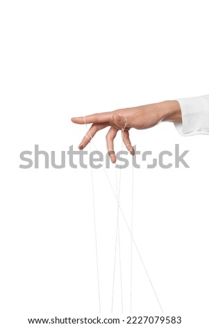 Woman pulling strings of puppet on white background, closeup