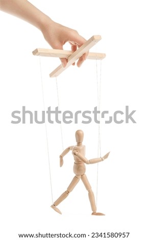Woman pulling strings of puppet on white background, closeup
