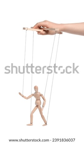 Woman pulling strings of puppet on white background, closeup