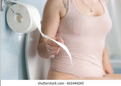 Woman Pulling Toilet Paper Tissue