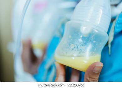 Woman pump milk to children at the hospital.