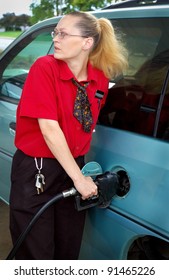 Woman Pumping Gas