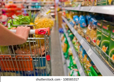 a woman in the purchase of food in a supermarket. everyday life of a housewife