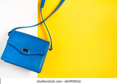 Woman Purse On Colorful Background. Blue And Yellow Pastel Colors, Top View