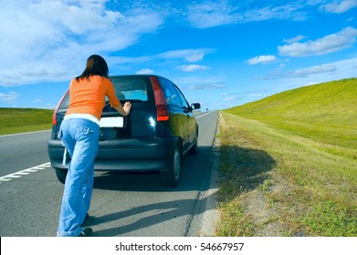 Woman Pushing A Car