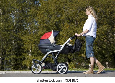 Woman With Pushing A Pram