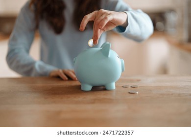 woman put coins euro into piggy bank planning savings and expenses energy bill tax invoice credit loan	 - Powered by Shutterstock