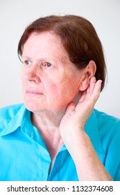 Woman Put Hand To Ear For Better Hearing