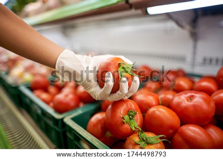       woman puts food in the store                         