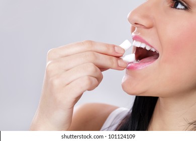 Woman Puts In Mouth Chewing Gum, Freshness Breath