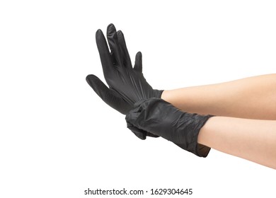 Woman puts on black rubber gloves. Isolated on white. - Shutterstock ID 1629304645