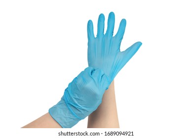 Woman Puts On Blue Rubber Gloves. Isolated On White.