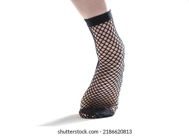 Woman Puts On Fishnet Socks On White Background