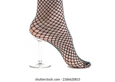 Woman Puts On Fishnet Socks On White Background