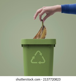 Woman Putting Biodegradable Organic Waste In A Bin, Recycling And Waste Segregation Concept