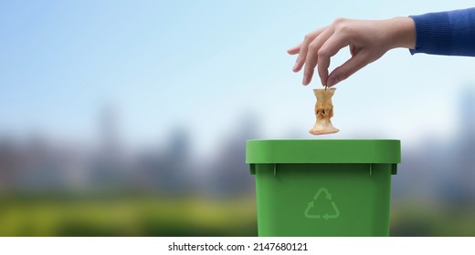 Woman Putting Biodegradable Organic Waste In A Bin, Recycling And Waste Segregation Concept