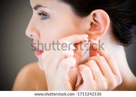 Similar – woman with earring