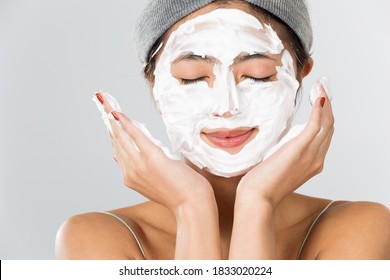 Woman Putting Foam On Face.