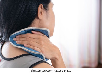 Woman Putting An Ice Pack On Her Neck Pain