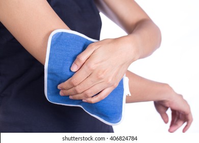 Woman Putting An Ice Pack On Her Elbow Pain