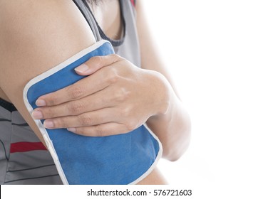 Woman Putting An Ice Pack On Her Arm Pain