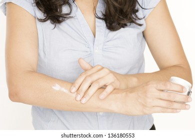 Woman Putting Lotion On Her Body Stock Photo Edit Now