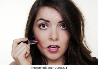 Woman Putting Make Up On And It When A Bit To Far So She Looks Silly