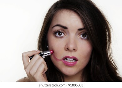 Woman Putting Make Up On And It When A Bit To Far So She Looks Silly