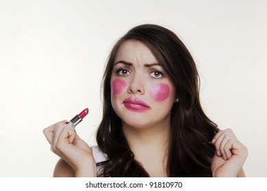 Woman Putting Make Up On And It When A Bit To Far So She Looks Silly