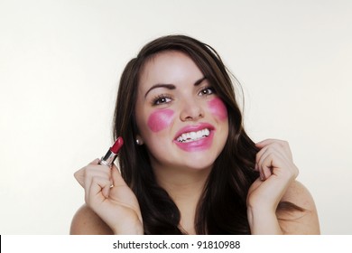 Woman Putting Make Up On And It When A Bit To Far So She Looks Silly