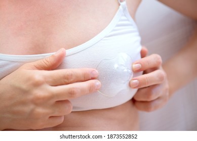 Woman putting a nipple shield on her bustier