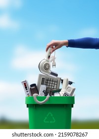 Woman Putting An Old Broken Appliance In The Trash Bin, E-waste And Recycling Concept