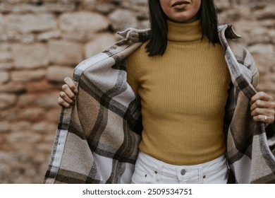 Woman putting on flannel jacket, autumn apparel fashion design - Powered by Shutterstock